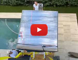 How to hoist a steel and wood bookcase with equipment over a swimming pool